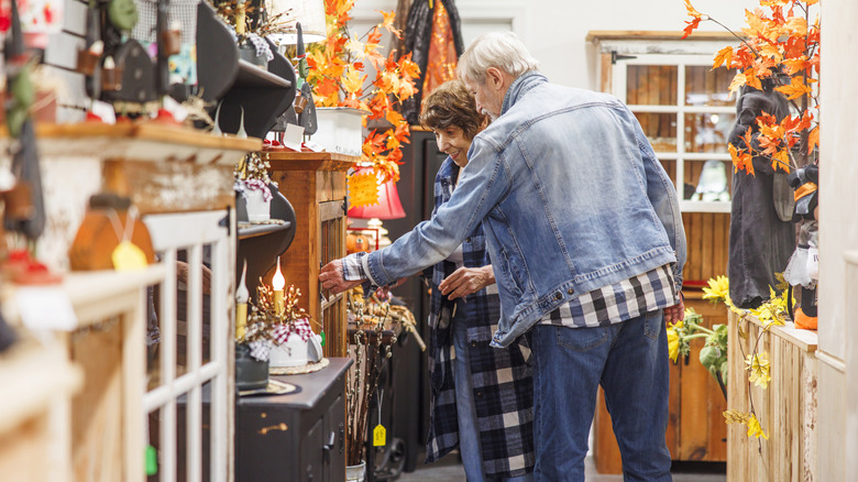 Older couple thrift store shopping