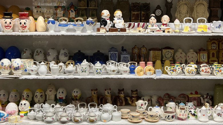 Collection of vintage salt and pepper shakers on shelf