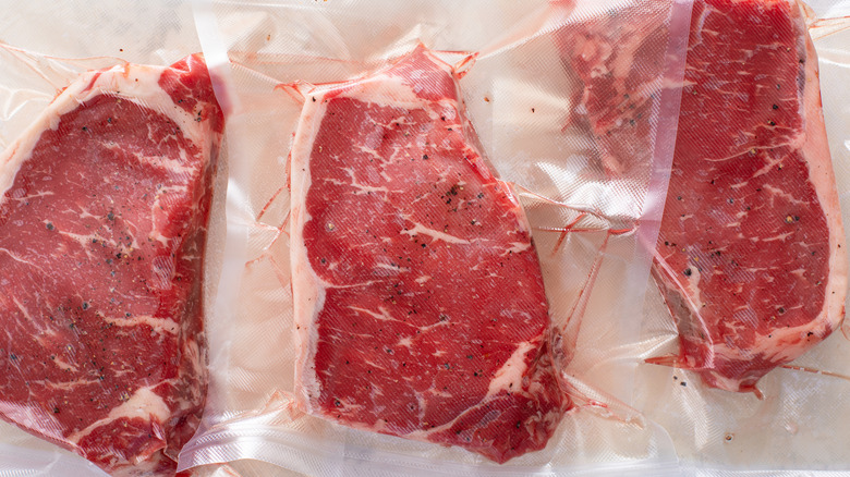 Overhead view of steaks in vaccum-sealed bags for sous vide cooking