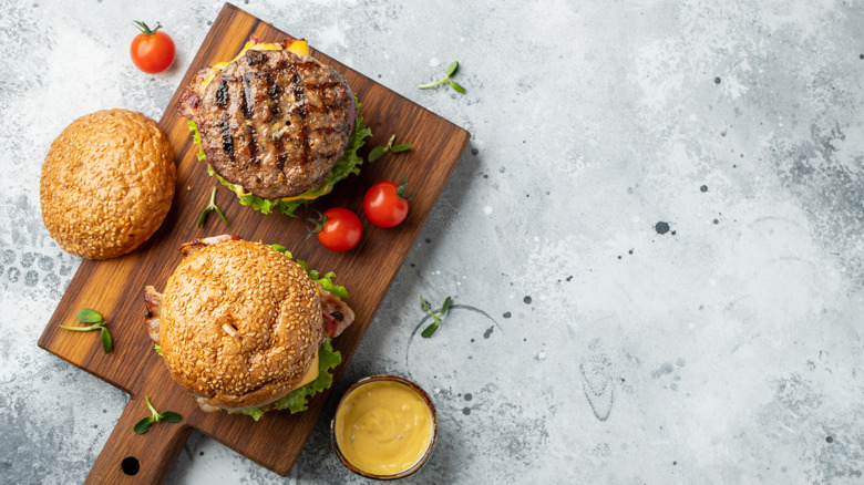 Burgers on cutting board