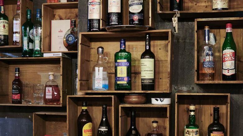 A collection of bottles stored in wooden boxes