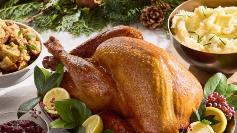 A turkey with sides of stuffing and mashed potato