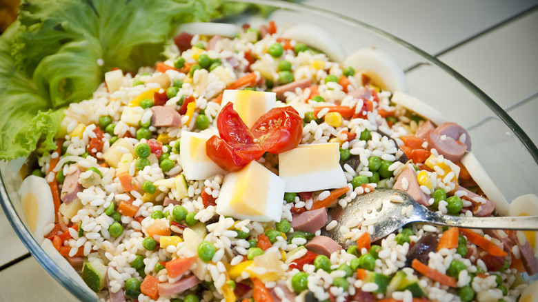 giant mixed salad with variety of ingredients