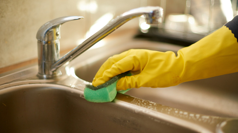 gently cleaning a stainless steel sink