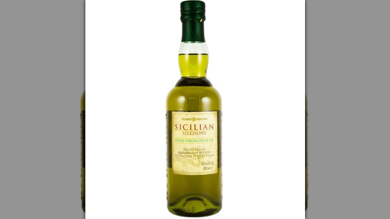 A bottle of Trader Joe's Sicilian olive oil is set against a white background.
