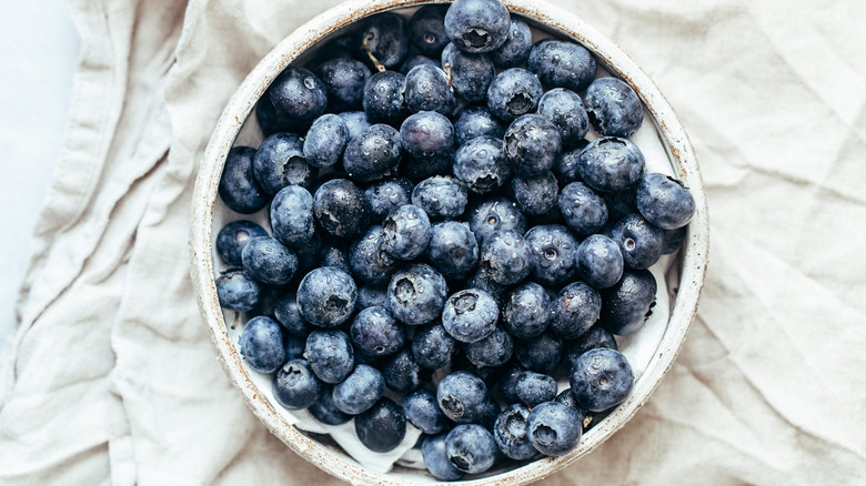 Bowl of blueberries on tablecloth