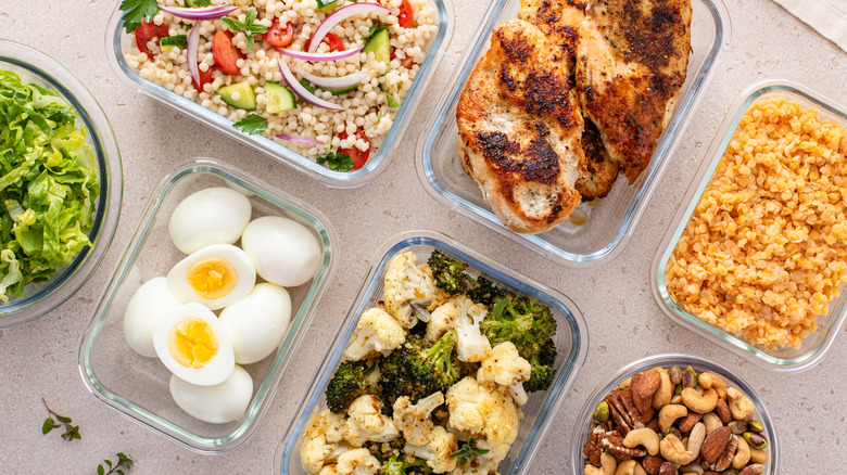 Overhead view of meal-prepped dishes in Tupperware