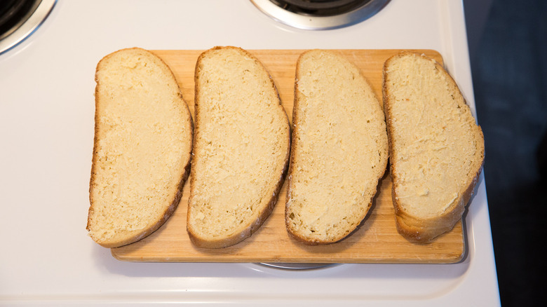 buttered bread slices on board