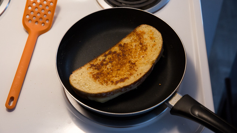 grilled cheese cooking in pan