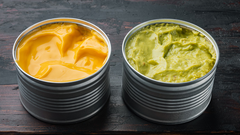 canned cheese and canned guacamole on a table