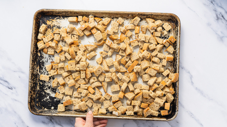 Buttered bread on baking sheet.
