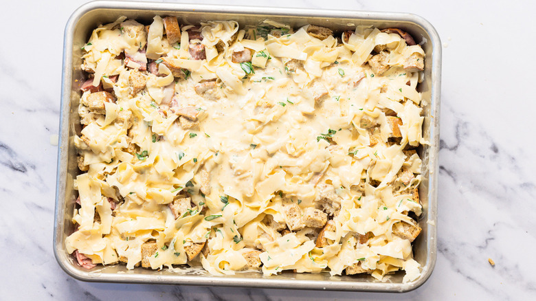 Casserole topped with cheesy sauce.