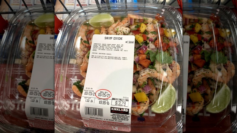 Plastic package of Kirkland Signature shrimp ceviche salad in shopping cart