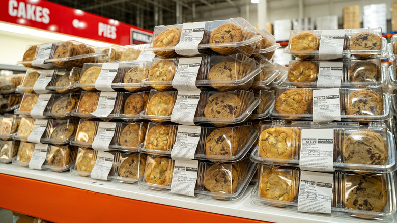 Various Costco cookies in plastic trays on shelf