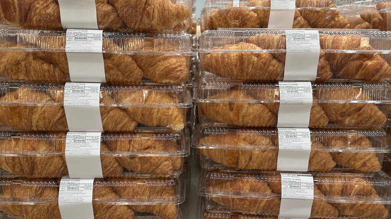 Costco croissants in plastic containers stacked on shelf
