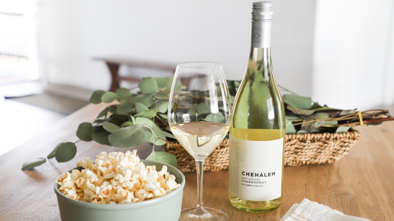 Bottle of Chehalem Inox with glass and popcorn
