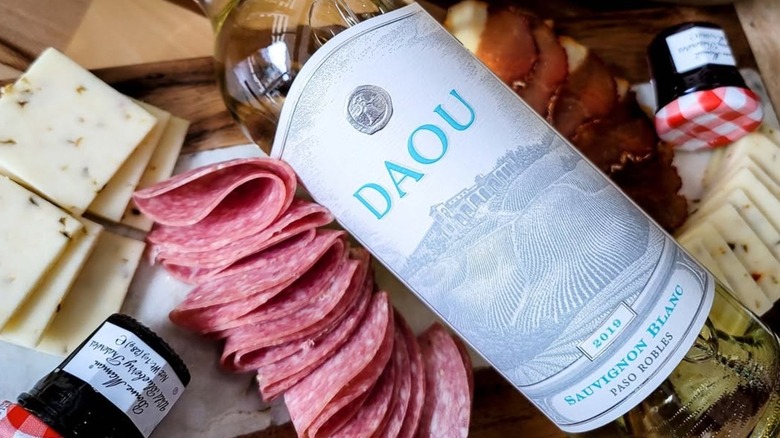 Bottle of Daou Sauvignon Blanc with charcuterie and cheese