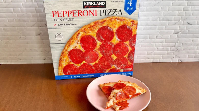 Kirkland pepperoni pizza box and slices on a plate