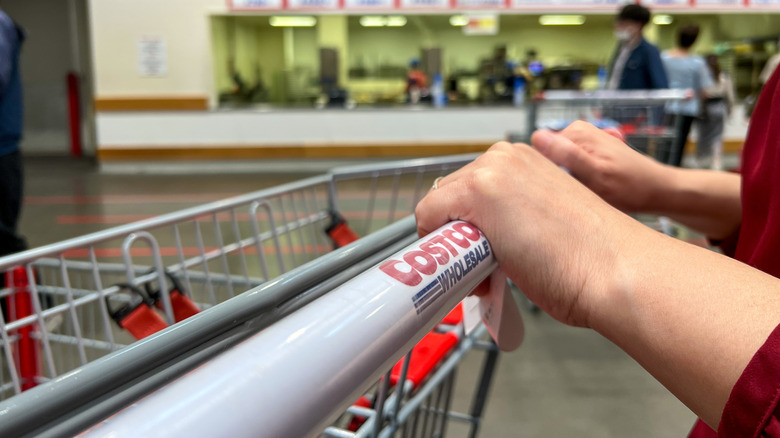 costco shopper pushing cart