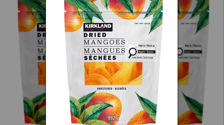 Packaging of Kirkland Signature Dried Mangoes bag against a white background.