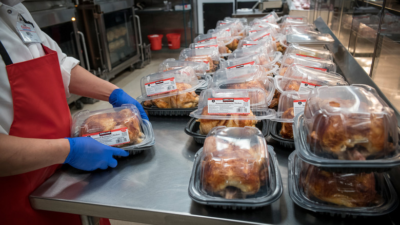 Costco employee packaging rotisserie chickens