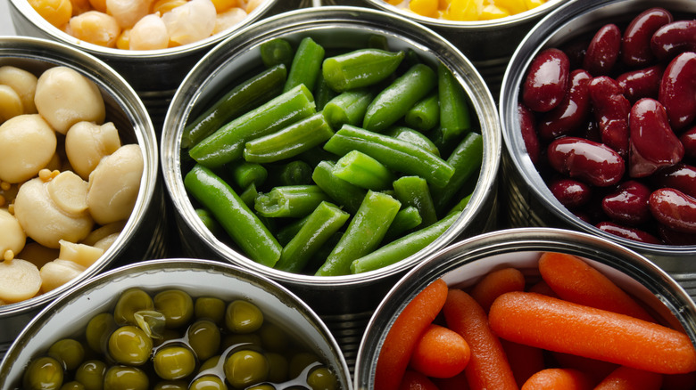 Canned vegetables in opened tin cans