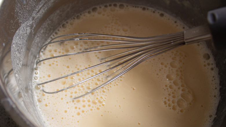 Pancake mix in a bowl with a whisk