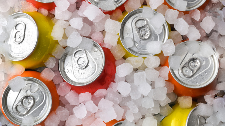 Top view of soda cans in ice