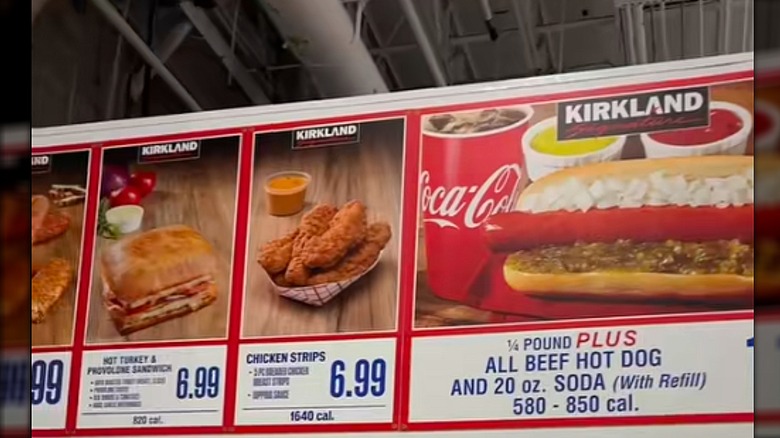 A Costco food court menu in Schaumburg, Illinois featuring chicken strips