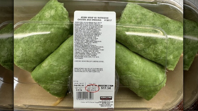 Tray of rotisserie chicken Asian wraps in spinach tortillas from Costco