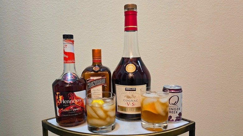 Hennessy VS bottle, Cointreau bottle, Q ginger beer, Kirkland Signature VS bottle and cocktails