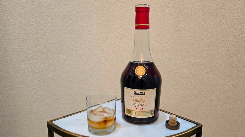 Bottle of Kirkland Signature VS cognac and glass.