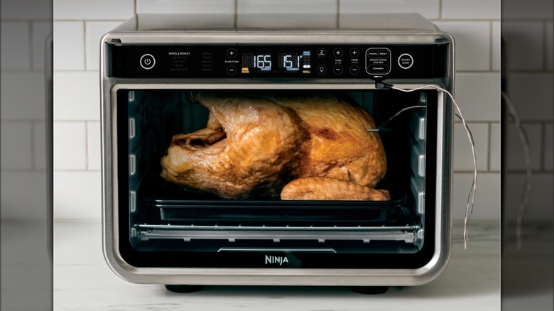 A Ninja Foodi 10-in-1 Smart Air Fryer Oven on counter