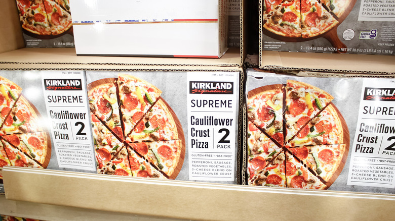Boxes of cauliflower crust supreme pizza at Costco, each containing two pizzas