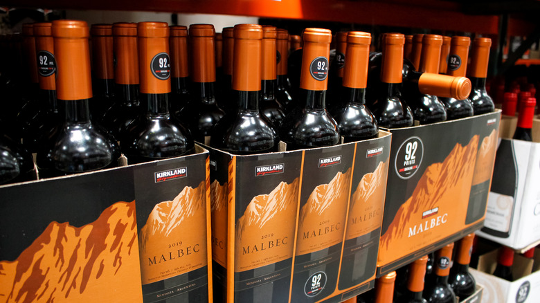 Several cases of Kirkland Signature Malbec wine stacked atop one another at Costco