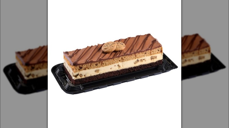Kirkland Signature Chocolate Chip Cookie Bar Cake on plastic display stand on white background