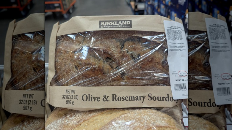 Costco's olive and rosemary sourdough bread in its paper and plastic bag