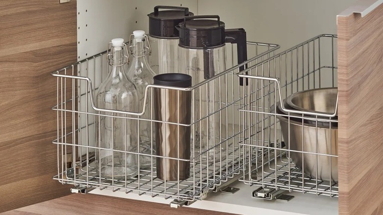 Trinity Baskets from Costco installed inside of lower cabinet, stocked with kitchen items