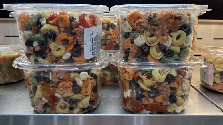 Four tubs of Costco Tortellini Pasta Salad