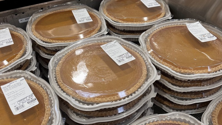 Pumpkin pies stacked in a fridge at a Costco warehouse