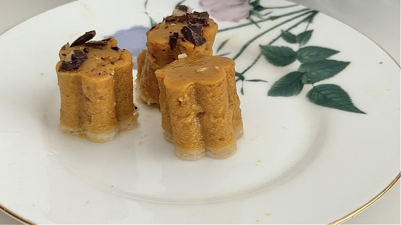 Cut out pieces of Costco pumpkin pie on a plate