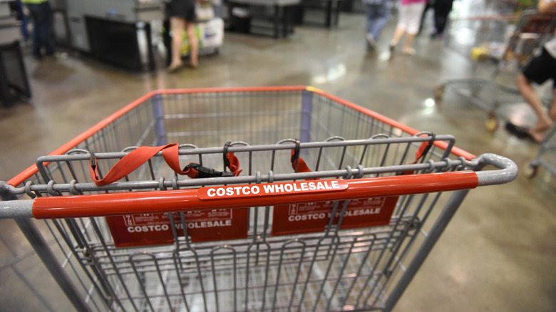 costco shopping cart in aisle of warehouse