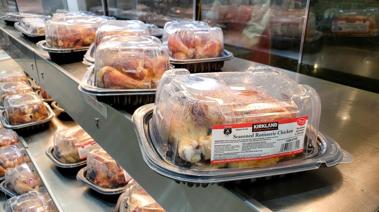 A Kirkland Signature Seasoned Rotisserie Chicken boxes in store