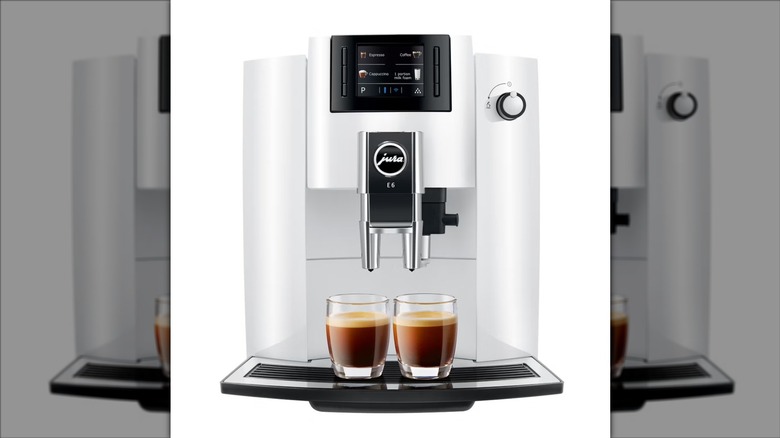 White Jura automatic espresso machine coffee maker on white background