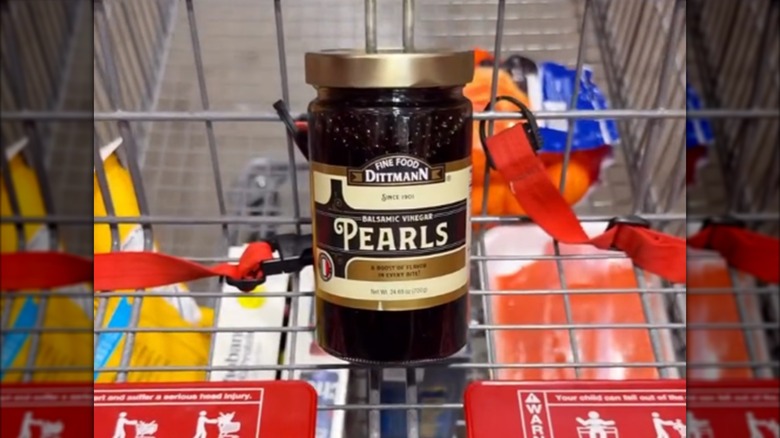 A jar of Fine Food Dittmann Balsamic Vinegar Pearls in a Costco cart