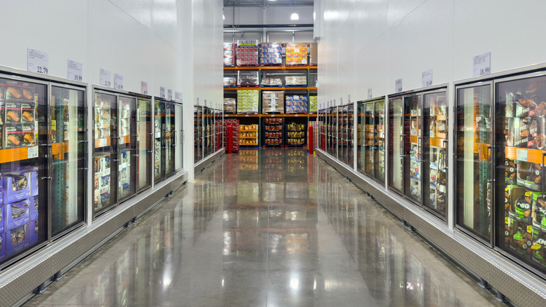 A long shot of both sides of a warehouse wholesale freezer aisle