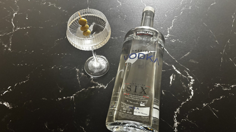 Martini with olives next to Kirkland vodka