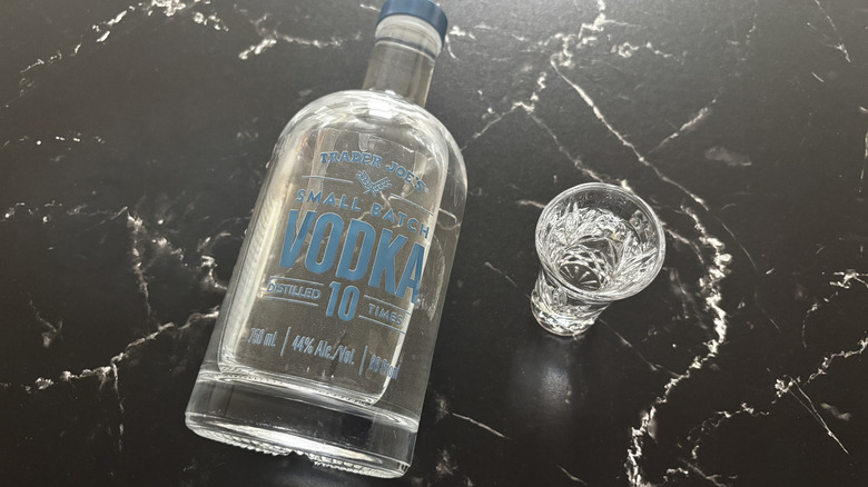 Trader Joe's small batch vodka next to shot of vodka