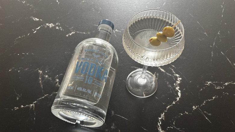 Trader Joe's small batch vodka next to martini with olives