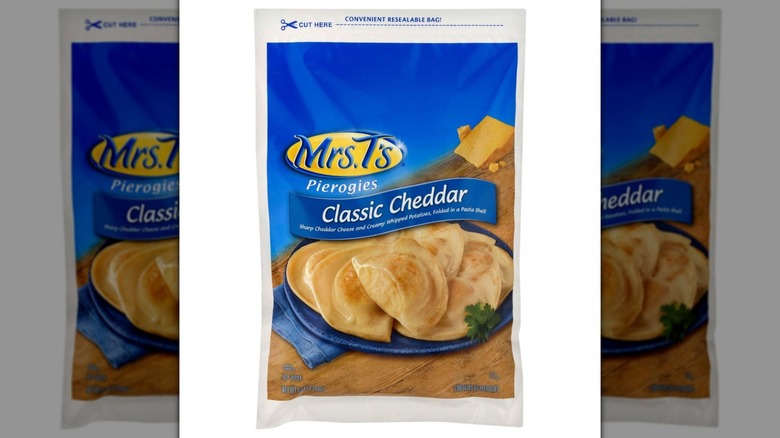 Blue bag of Mrs. T's Potato And Cheddar frozen pierogies on white background